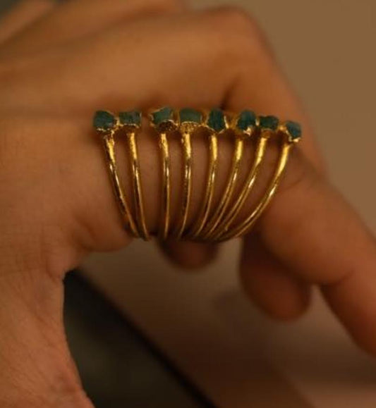 Ring with raw emeralds and amethysts.